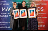 Tre medarbetare från SBC håller upp varsitt diplom från Magnet Awards